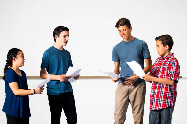 Scene Study class, people standing reading scripts together