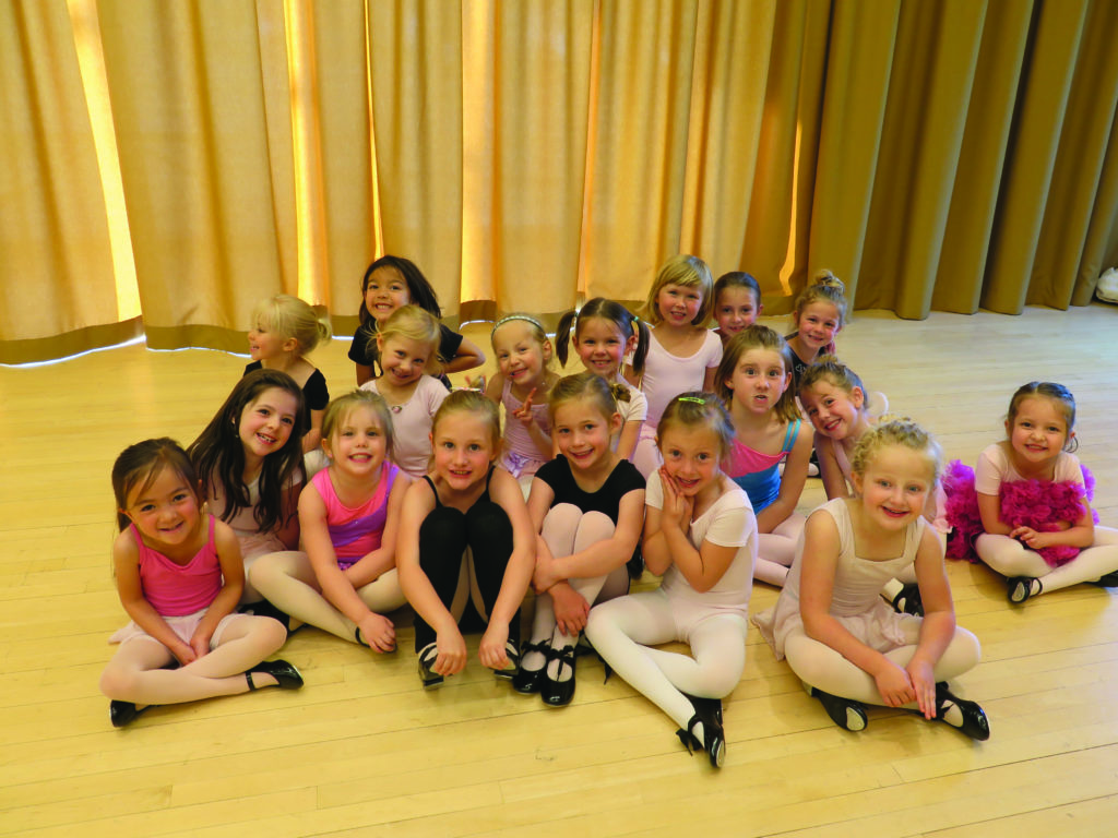 dance camp - little dancers sitting on floor for picture with dance clothes and tap shoes