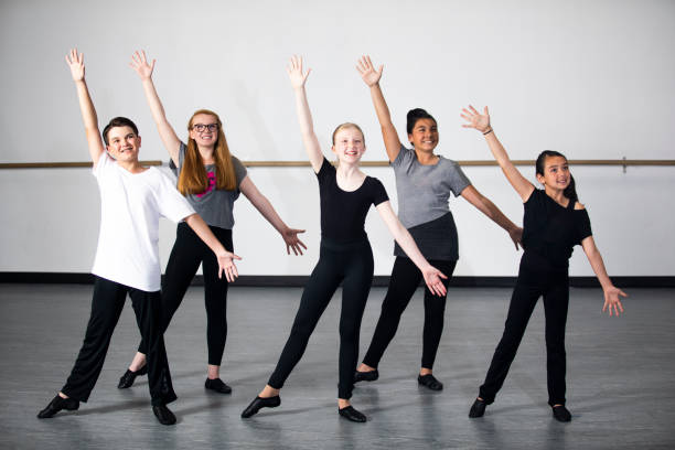 A Diverse group of Young Students Practicing Musical Theatre Dance in Studio