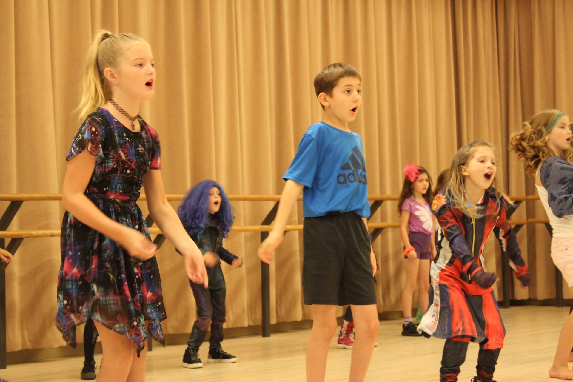 Theater class with boy and girls in costume