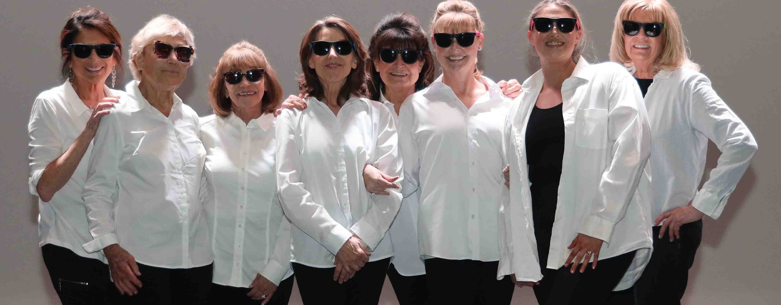 On Pointe_Dance Connection 9 Adult dance class participants in costume - white shirts and sunglasses - stopping to pose for photo
