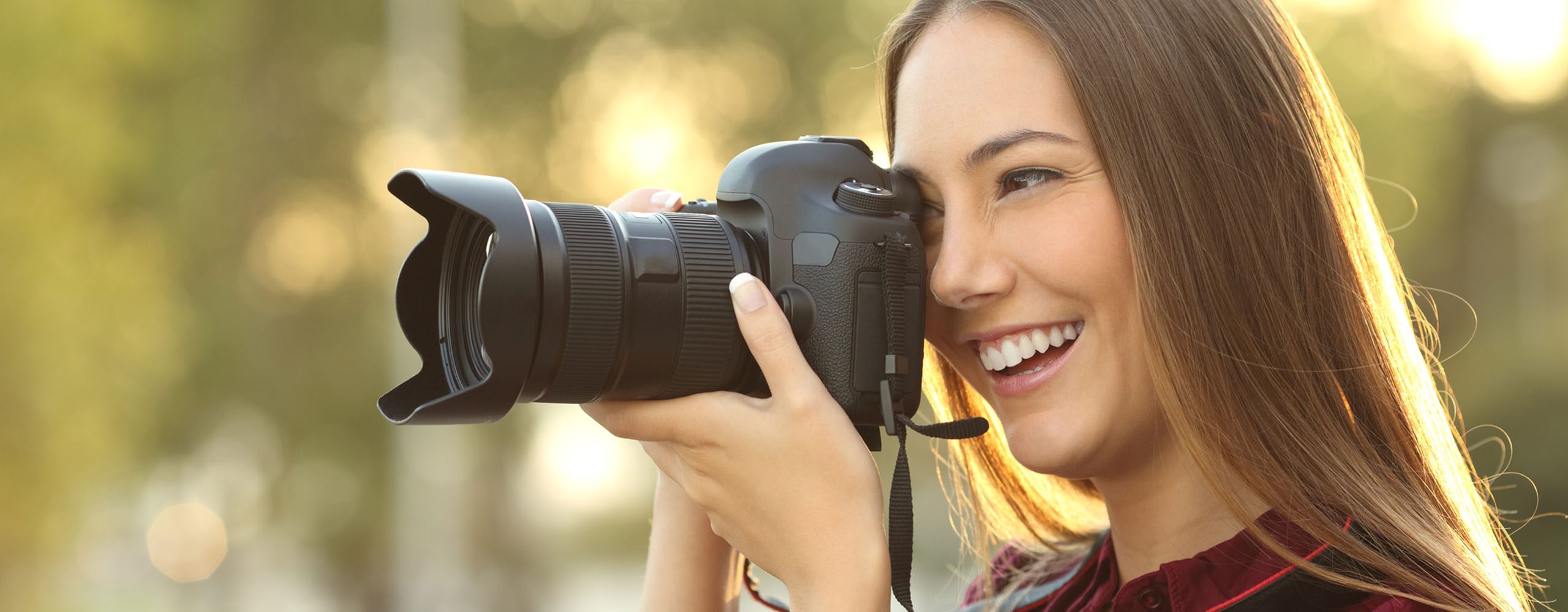 Photographer taking photo with camera