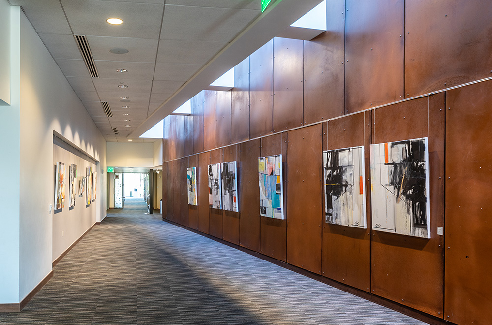 View of a hallway decorated with hanging art inside the PACE Center View of a hallway decorated with hanging art inside the PACE Center