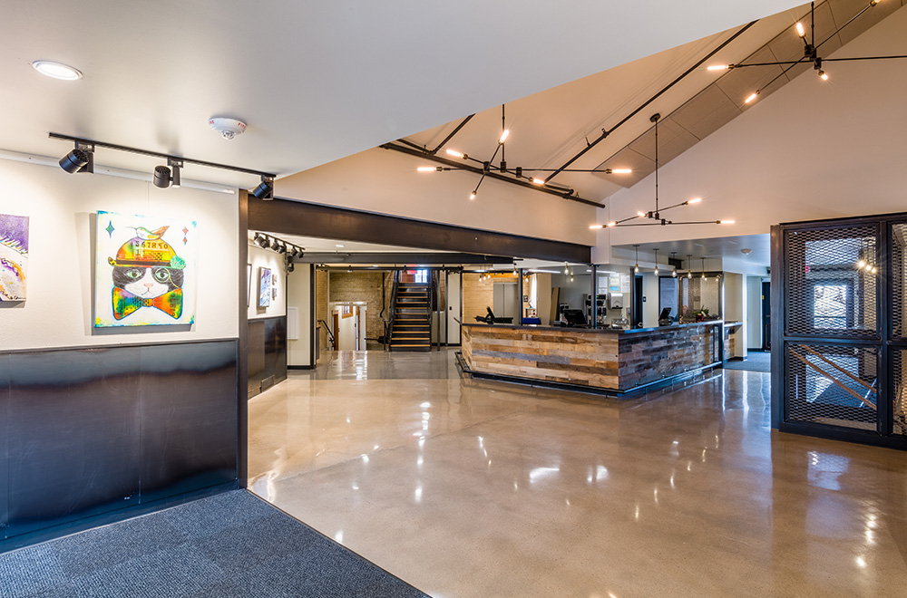 Schoolhouse main floor with concessions and multiple art pieces hanging on the walls Schoolhouse main floor with concessions and multiple art pieces hanging on the walls