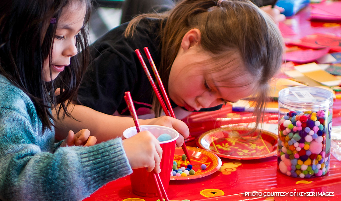 Kids using chopsticks to create art