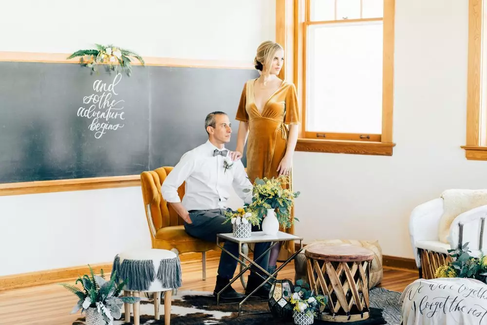 Couple posing in wedding space at The Schoolhouse in Parker, CO.